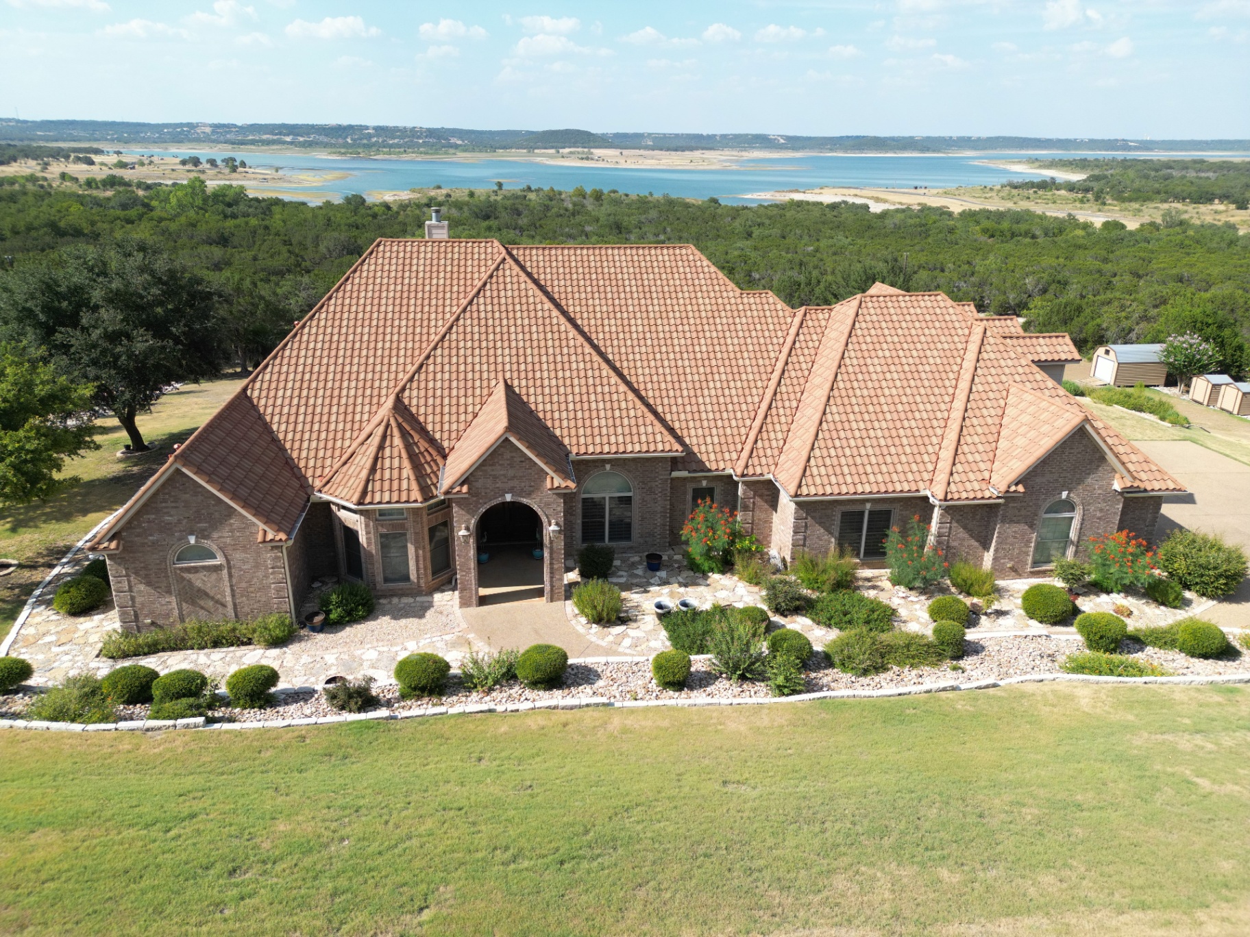 Modern home with a new architectural shingle roof at sunset
